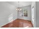 Elegant dining room featuring hardwood floors, chandelier lighting, and plenty of natural light at 2732 Pierce Brennen Ct, Lawrenceville, GA 30043