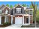 Charming townhome showcasing a blend of brick and siding, a single garage, and a welcoming entrance at 2732 Pierce Brennen Ct, Lawrenceville, GA 30043
