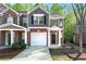 Charming two-story townhome with attached garage and well-manicured front yard in a desirable neighborhood at 2732 Pierce Brennen Ct, Lawrenceville, GA 30043