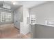 Bright hallway featuring neutral carpet, three windows, and a closed closet providing natural light and ample storage at 2732 Pierce Brennen Ct, Lawrenceville, GA 30043