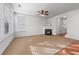 Spacious living room featuring a fireplace, large windows, and a neutral color palette at 2732 Pierce Brennen Ct, Lawrenceville, GA 30043