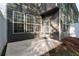 Exterior patio area featuring a concrete slab, gray siding, and natural light at 2732 Pierce Brennen Ct, Lawrenceville, GA 30043