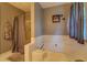 Bathroom featuring a large soaking tub with shower curtain at 293 Country Lake Dr, Mcdonough, GA 30252