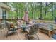 Relaxing deck area with seating and a wooded view at 293 Country Lake Dr, Mcdonough, GA 30252