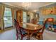 Traditional dining room with a large wooden table, chandelier, and ample natural light at 293 Country Lake Dr, Mcdonough, GA 30252