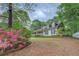 Charming two-story home with a welcoming front porch and landscaped yard on a spacious lot at 293 Country Lake Dr, Mcdonough, GA 30252