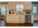 Eat-in kitchen with stainless steel dishwasher, ample counter space, and bright window with view at 293 Country Lake Dr, Mcdonough, GA 30252