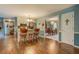 Open kitchen featuring an island with barstool seating, and adjoining dining area with chandelier at 293 Country Lake Dr, Mcdonough, GA 30252