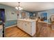 Open kitchen with breakfast bar, stainless steel appliances, and views of other rooms in the house at 293 Country Lake Dr, Mcdonough, GA 30252