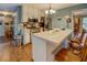Kitchen with breakfast bar, stainless steel appliances, hardwood floors, and recessed lighting at 293 Country Lake Dr, Mcdonough, GA 30252