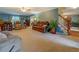 Spacious living room with comfortable seating, neutral carpet and access to the dining room at 293 Country Lake Dr, Mcdonough, GA 30252