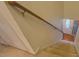 Carpeted staircase leads to a front door with wood railing at 293 Country Lake Dr, Mcdonough, GA 30252