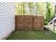 View of backyard with wooden privacy fence and green grass at 3137 Perimeter Cir, Buford, GA 30519