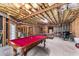 Unfinished basement with exposed beams, pool table, and good potential at 3137 Perimeter Cir, Buford, GA 30519