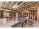 Spacious unfinished basement featuring a pool table and ping pong table at 3137 Perimeter Cir, Buford, GA 30519