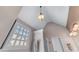 Bathroom with high ceilings, stylish lighting fixtures and large window for natural light at 3137 Perimeter Cir, Buford, GA 30519