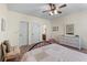 Comfortable bedroom with neutral walls, ceiling fan, and ample closet space at 3137 Perimeter Cir, Buford, GA 30519