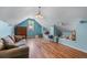 Bonus room with hardwood floors, sofa, window nook with natural light, and plenty of space at 3137 Perimeter Cir, Buford, GA 30519