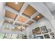 Elegant coffered ceiling with recessed lighting and a decorative chandelier enhances the room's ambiance at 3137 Perimeter Cir, Buford, GA 30519