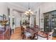 Spacious dining room featuring hardwood floors, classic furnishings, and elegant lighting at 3137 Perimeter Cir, Buford, GA 30519
