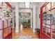 Inviting foyer with hardwood floors, high ceilings, and an open view into the living spaces at 3137 Perimeter Cir, Buford, GA 30519