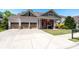 Beautiful home with a three-car garage, a well-manicured lawn, and wide driveway with a basketball hoop at 3137 Perimeter Cir, Buford, GA 30519