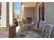 Cozy front porch features stone flooring, seating, and stylish decor, perfect for relaxing outdoors at 3137 Perimeter Cir, Buford, GA 30519