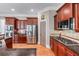 Kitchen featuring stainless steel appliances, granite countertops, and hardwood floors at 3137 Perimeter Cir, Buford, GA 30519