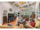 Bright living room featuring a coffered ceiling, large windows, and comfortable seating area at 3137 Perimeter Cir, Buford, GA 30519
