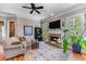 Cozy living room with fireplace, hardwood floors, and natural light at 3137 Perimeter Cir, Buford, GA 30519