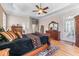 Large main bedroom with tray ceiling, decorative rug, and access to the backyard at 3137 Perimeter Cir, Buford, GA 30519