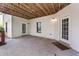 Covered patio with concrete flooring and access to backyard and basement at 3137 Perimeter Cir, Buford, GA 30519