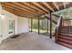 Covered patio with staircase leading to the backyard, perfect for entertaining at 3137 Perimeter Cir, Buford, GA 30519