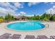 Enjoy the outdoors with this community pool and clubhouse with lounge chairs for relaxing at 3137 Perimeter Cir, Buford, GA 30519