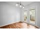 Bright dining room featuring beautiful hardwood floors and a stylish light fixture at 6940 Roswell Rd # 24E, Sandy Springs, GA 30328