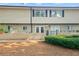 Traditional townhome with brick facade, neutral siding, and well-maintained landscaping at 6940 Roswell Rd # 24E, Sandy Springs, GA 30328