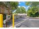 Gated community entrance with security keypad for residents' privacy and security at 6940 Roswell Rd # 24E, Sandy Springs, GA 30328