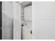 Convenient laundry closet with stackable washer and dryer, and built-in shelves at 6940 Roswell Rd # 24E, Sandy Springs, GA 30328