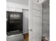 Kitchen pantry with plenty of shelving next to a refrigerator and breakfast bar at 6940 Roswell Rd # 24E, Sandy Springs, GA 30328