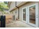Back patio with gray brick fence and double doors at 6940 Roswell Rd # 24E, Sandy Springs, GA 30328