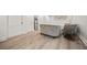 Finished basement featuring new flooring, modern sofas, and a small refrigerator at 2433 Helmsdale Ne Dr, Atlanta, GA 30345
