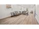 Finished basement with new flooring, two sofas, side tables, and natural light at 2433 Helmsdale Ne Dr, Atlanta, GA 30345