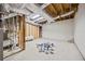Unfinished basement with exposed ductwork, plumbing and some building materials on concrete floor at 2433 Helmsdale Ne Dr, Atlanta, GA 30345