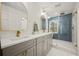 Modern bathroom features a double vanity, glass shower, and luxury fixtures at 2433 Helmsdale Ne Dr, Atlanta, GA 30345