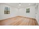 Clean, bright bedroom with hardwood floors, closet, and natural light from the window at 2433 Helmsdale Ne Dr, Atlanta, GA 30345