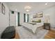 Cozy bedroom featuring hardwood floors, neutral paint, and ample natural light at 2433 Helmsdale Ne Dr, Atlanta, GA 30345