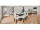 Elegant dining area with seating for six, hardwood floors, and modern lighting at 2433 Helmsdale Ne Dr, Atlanta, GA 30345