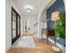 Inviting foyer with hardwood floors, stylish lighting, and a charming console table at 2433 Helmsdale Ne Dr, Atlanta, GA 30345