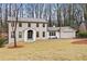 Charming two-story brick home with a well-manicured lawn and mature trees in a peaceful setting at 2433 Helmsdale Ne Dr, Atlanta, GA 30345