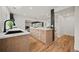 Open-concept kitchen with eat-in area and views of the living room with a fireplace at 2433 Helmsdale Ne Dr, Atlanta, GA 30345